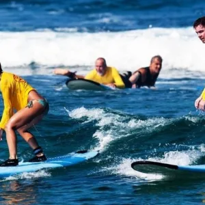 Two students receiving surf instruction together