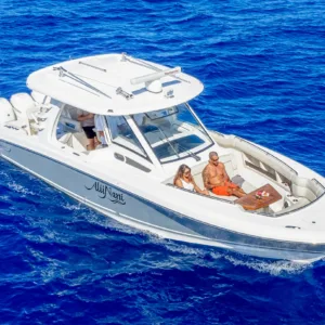 Luxury yacht cruising near Maui coastline on sunny day