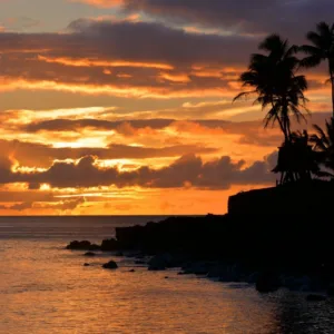 Couple enjoying a Hawaiian sunset on a private boat