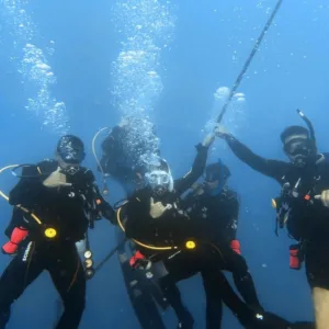 Diving student learning with professional SSI instructor