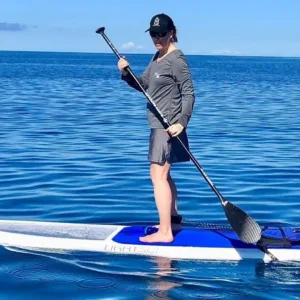 Early morning paddleboarding on calm ocean