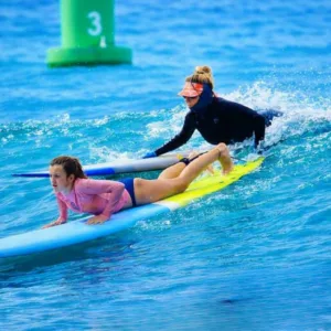 Surfboards and wetsuits ready for lesson