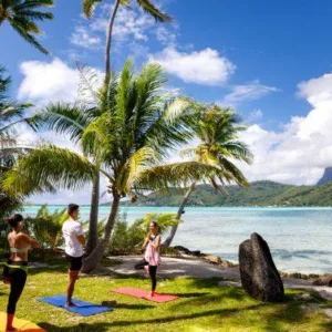 Yoga session on a private islet with turquoise waters