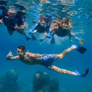 Snorkelers exploring vibrant coral reef