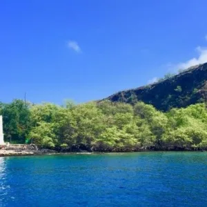 Boat cruising near Kailua-Kona coastline