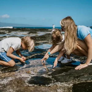 Children exploring ocean life with naturalist guide