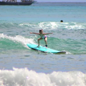 Child aged 4 to 11 taking a private surf lesson