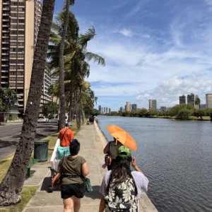 Tour group stopping along Ala Wai Canal